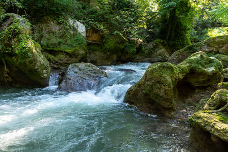 river in the woods coming from the waterfall of the marmore where they also do raftingの写真素材