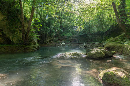river in the woods coming from the waterfall of the marmore where they also do raftingの写真素材