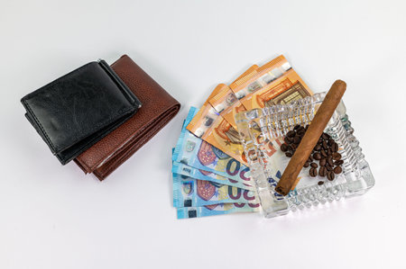 20 and 50 euro bills with currency symbol and wallet on the tableの写真素材