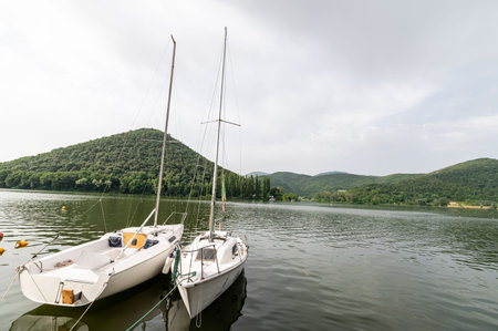 piediluco,italy june 23 2021:piediluco lake with boats by the lakeのeditorial素材