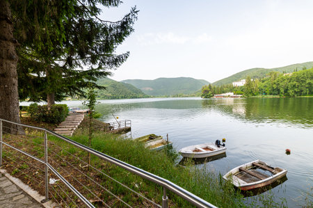 piediluco,italy june 23 2021:piediluco lake with boats by the lakeのeditorial素材