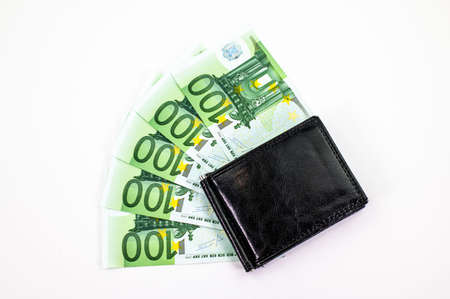 100 euro bills scattered on white background with walletの写真素材