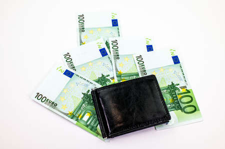 100 euro bills scattered on white background with walletの写真素材