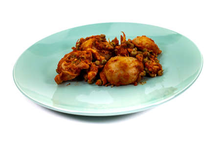 composition of plate with cuttlefish and peas on wooden table with glass cutleryの写真素材