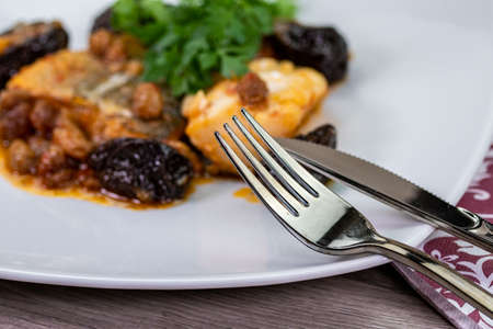 detail of cutlery on a fish plateの写真素材