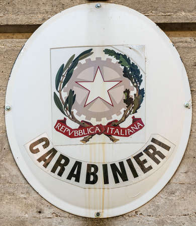 coat of arms of the carabinieri in front of the barracksの写真素材