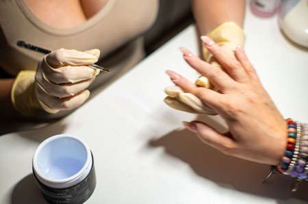 nail reconstruction with monophasic gel and file and burの写真素材