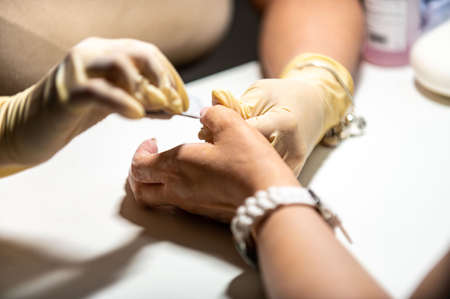 nail reconstruction with monophasic gel and file and burの写真素材