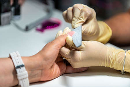 nail reconstruction with monophasic gel and file and burの写真素材