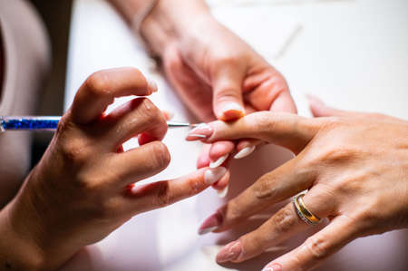 nail reconstruction with monophasic gel and file and burの写真素材