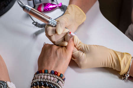 nail reconstruction with monophasic gel and file and burの写真素材