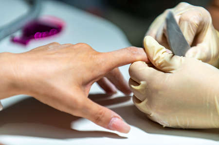 nail reconstruction with monophasic gel and file and burの写真素材