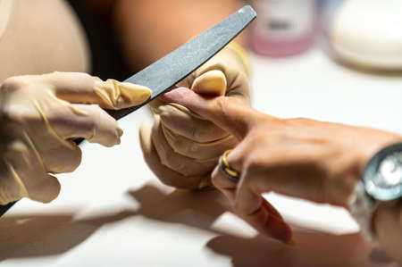 nail reconstruction with monophasic gel and file and burの写真素材