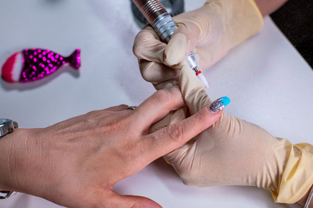 nail reconstruction with monophasic gel and file and burの写真素材