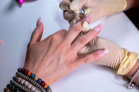 nail decorations with special uv gel using various color gel led lampの写真素材