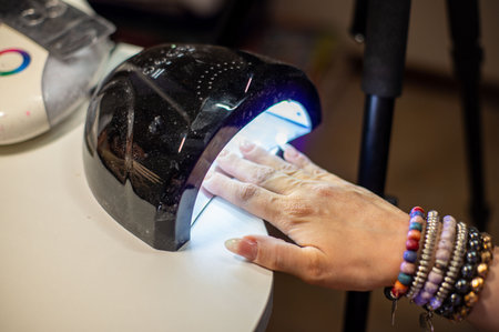 nail decorations with special uv gel using various color gel led lampの写真素材