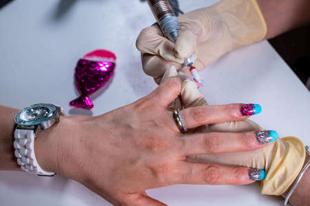 nail decorations with special uv gel using various color gel led lampの写真素材