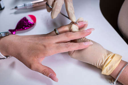 nail decorations with special uv gel using various color gel led lampの写真素材