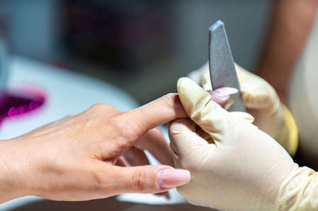 nail reconstruction with monophasic gel and file and burの写真素材