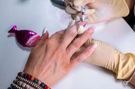 nail reconstruction with monophasic gel and file and burの写真素材
