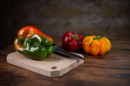 composition of vegetables with cutting board on wooden surfaceの写真素材