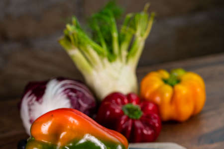 composition of vegetables with cutting board on wooden surfaceの写真素材
