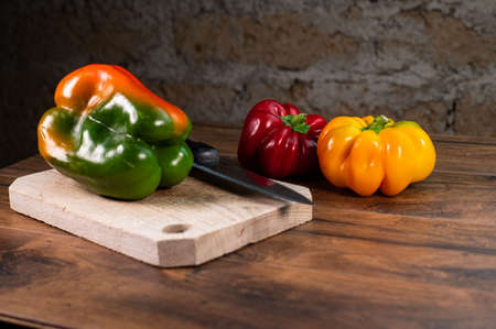composition of vegetables with cutting board on wooden surfaceの写真素材
