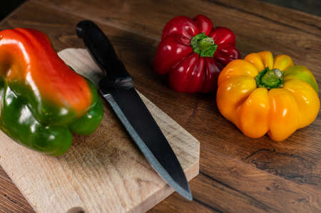 composition of vegetables with cutting board on wooden surfaceの写真素材