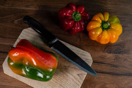 composition of vegetables with cutting board on wooden surfaceの写真素材