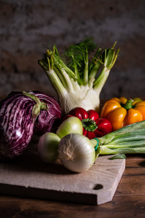 composition of vegetables with cutting board on wooden surfaceの写真素材