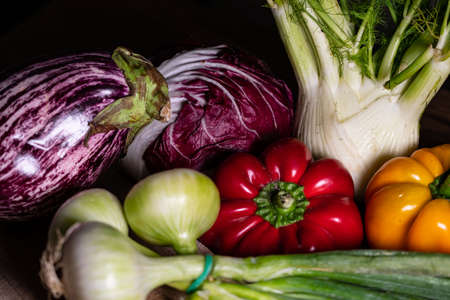 composition of vegetables with cutting board on wooden surfaceの写真素材