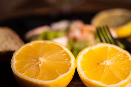 composition of a black plate with shrimp and surimi salad on a white satin backgroundの写真素材
