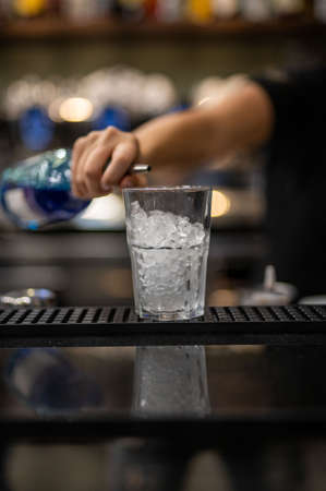 composition of various cocktails on the counter in strong colors and fruit on the headの写真素材