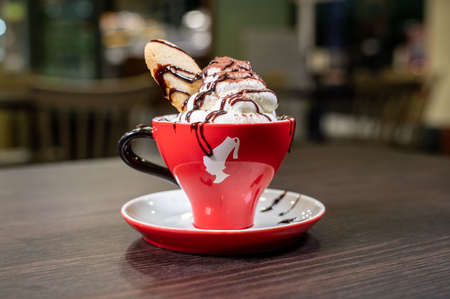 terni, italy october 08 2021: cup of chocolate and cream with biscuitのeditorial素材