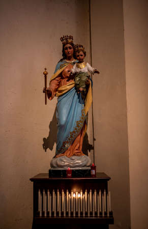 statue of the madonna with jesus in the churchの写真素材
