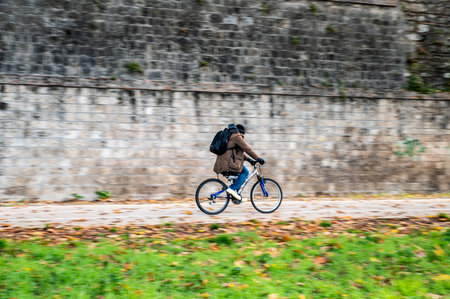 Terni, Italy December 04 2021: panning of a passing bicycleのeditorial素材