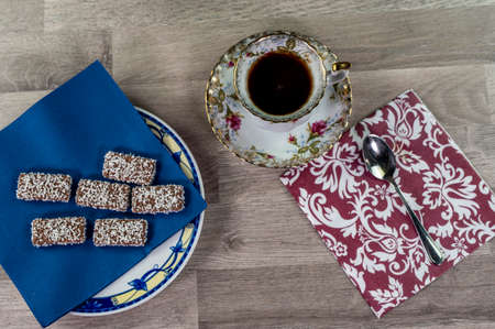 brioche with glass of milk and coffee on wooden surfaceの写真素材