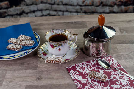 brioche with glass of milk and coffee on wooden surfaceの写真素材