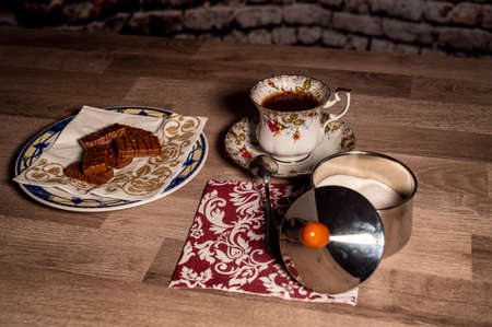 composition cup tea biscuits with sugar bowl on wooden topの写真素材