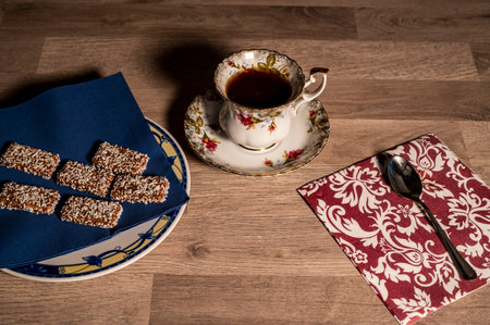 composition cup tea biscuits with sugar bowl on wooden topの写真素材