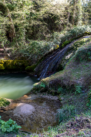 streams with pools of water of the marmore waterfall on a sunny dayの写真素材