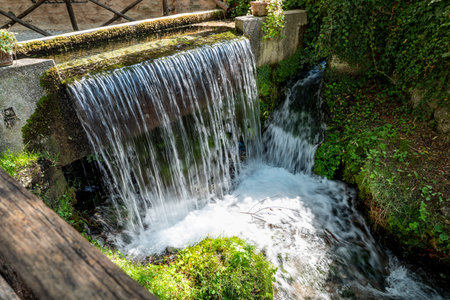 Rasiglia, a village characterized by streams and waterfalls amidst the buildingsの写真素材