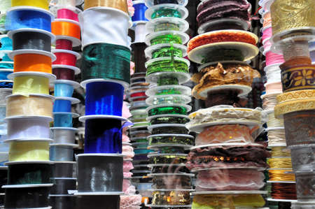 Variety selection of decorative colorful ribbons and laces in hand craft shop の写真素材