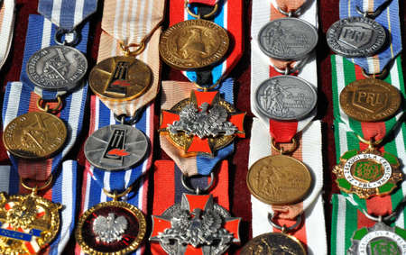 GRUDZIADZ, POLAND - JUNE 18 : Variety of antique medals for sale on the street market on June 18, 2015 in Grudziadz, Poland. On photo - antique medals of merit.のeditorial素材