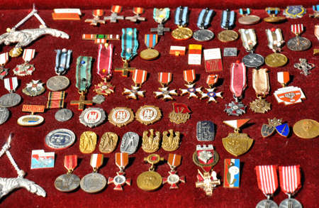 GRUDZIADZ, POLAND - JUNE 18 : Variety of antique medals for sale on the street market on June 18, 2015 in Grudziadz, Poland. On photo - antique medals and badges of the war and communism period.のeditorial素材