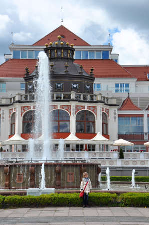 SOPOT, POLAND - JUNE 23: Little girl posing with Art Noveau style Health Spa House on June 23, 2015 in Sopot, Polandのeditorial素材