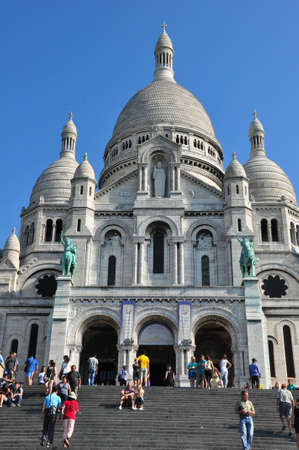 PARIS, FRANCE - JULY 7: Sacre Coeur in summer day. Large medieval cathedral. Basilica of Sacred Heart. Popular landmark, highest city point. July 7, 2013, Paris, France, Europe.のeditorial素材