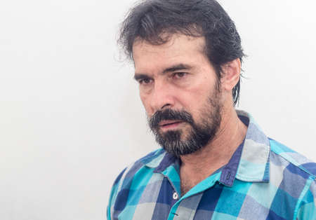 White man with beard, blue plaid shirt, black hair, various expressionsの写真素材