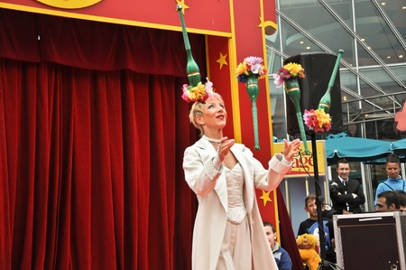 disneyland paris, august, 13, 2010 - disney village,  little circus, juggler with ninepins in disney village out of disneyland parisのeditorial素材