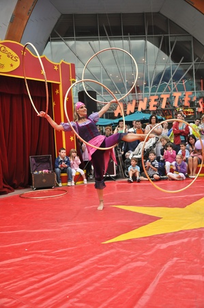 disneyland paris, august, 13, 2010 - disney village,  little circus entertainment hola hoop dancer in disney village out of disneyland parisのeditorial素材